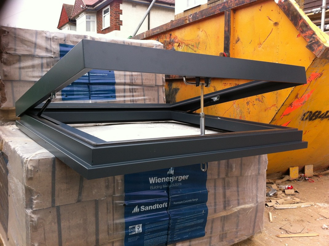 Opening flat roof skylight in anthracite grey installed in Northolt